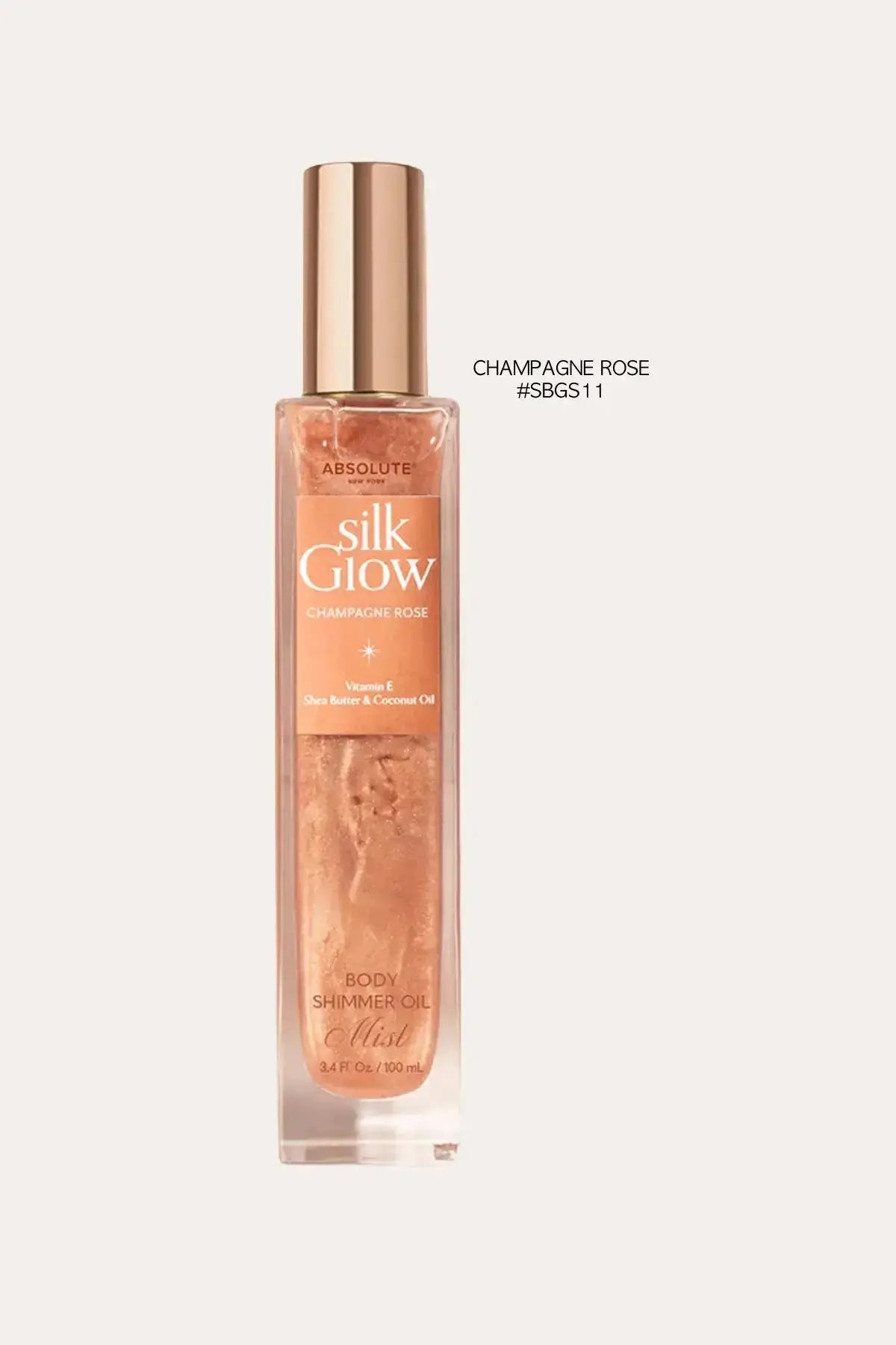 Absolute New York Silk Glow Champagne Rose body shimmer oil mist, 100 mL – Sun Kissed Glow FOR FACE inspired finish, rose-toned shimmer bottle on a clean light background.
