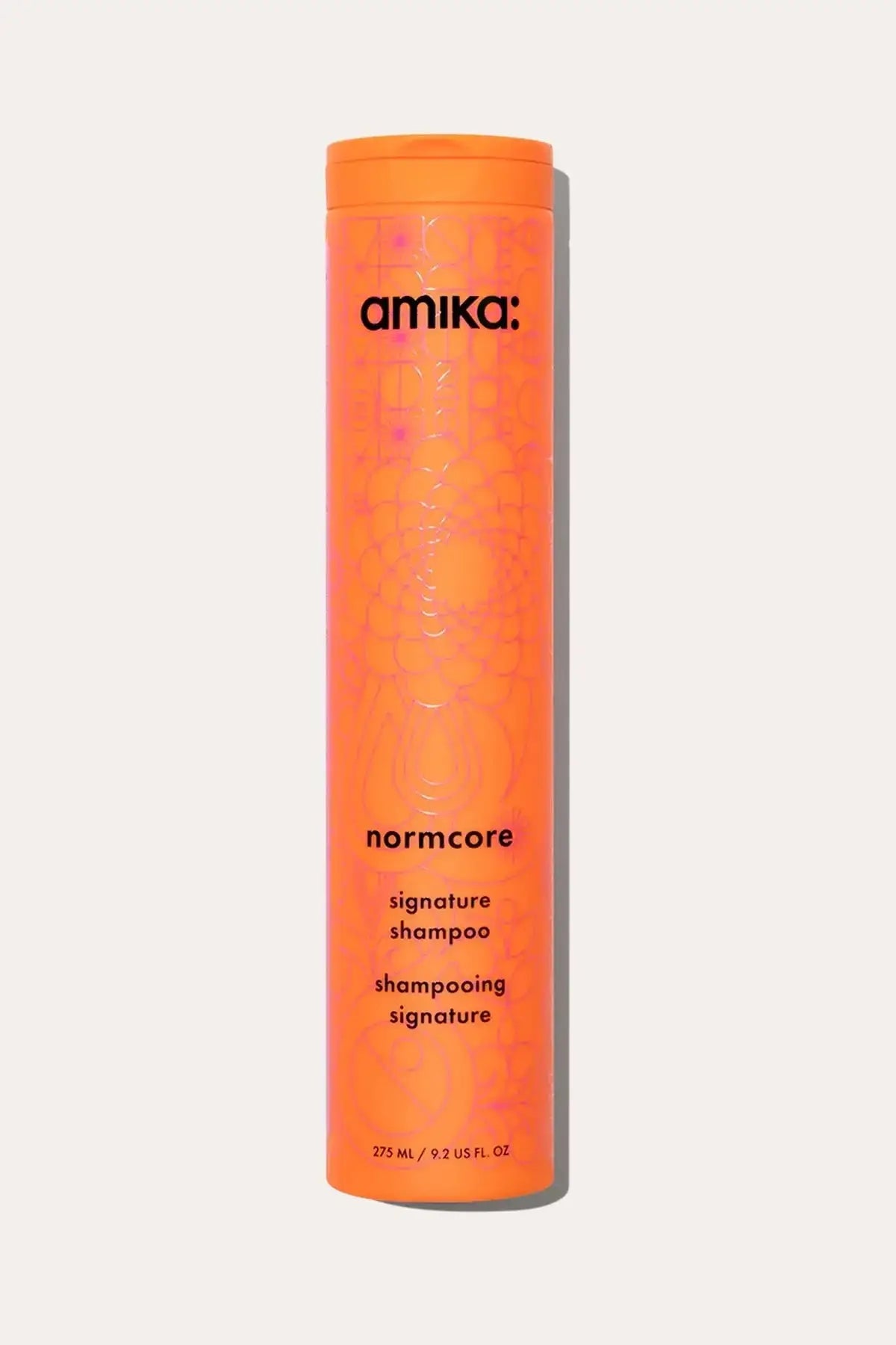 Amika Normcore Signature Shampoo bottle, a gentle Color Safe Shampoo designed for all hair types.