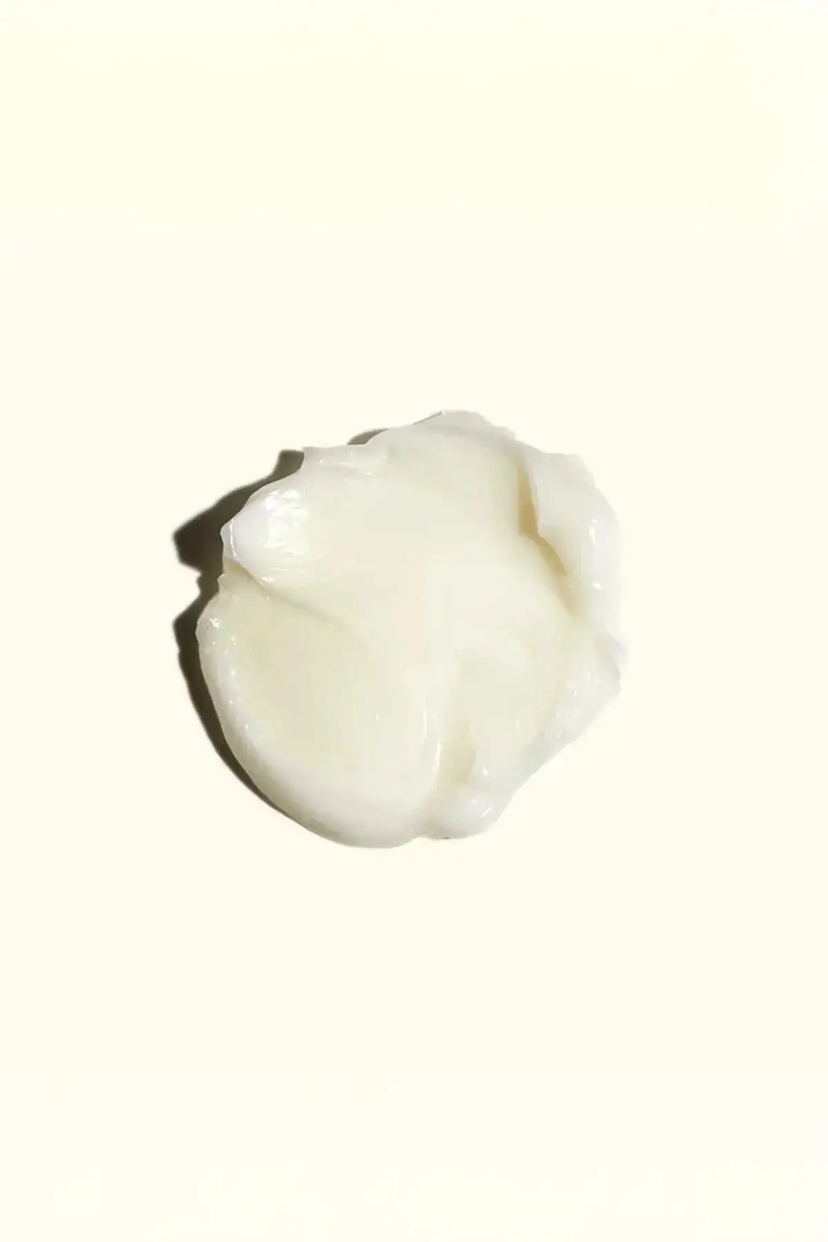 Close-up of the rich, creamy texture swatch of the Amika Soulfood Nourishing Mask.